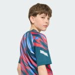 Camiseta de calentamiento para niños del Arsenal FC, temporada 26/27. Equipación prepartido oficial para los jóvenes gunners.