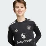 Camiseta de portero para niños del Manchester United temporada 26/27. Vista frontal de la equipación oficial para jóvenes.