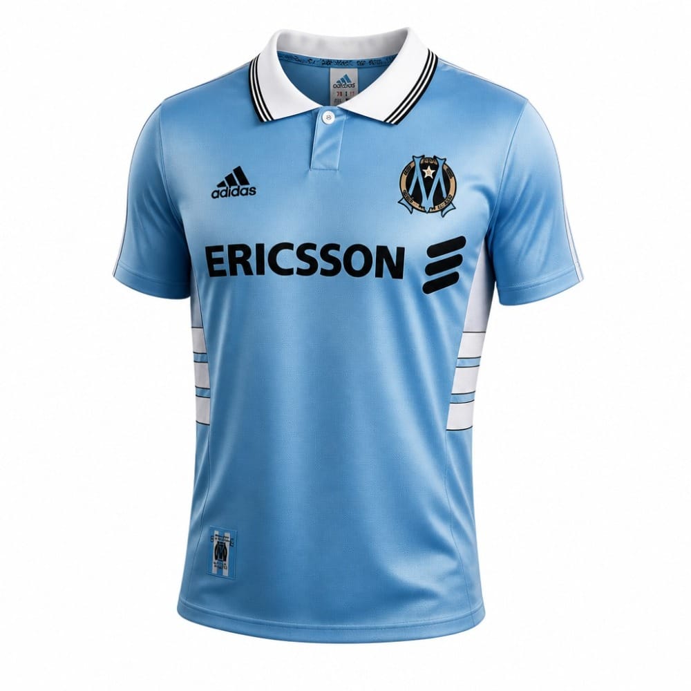 Camiseta Retro Olympique de Marsella 1998/99 Segunda Equipación Camiseta retro de la segunda equipación del Olympique de Marsella de la temporada 1998/99. Diseño azul marino con detalles dorados.