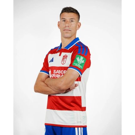 Camiseta de fútbol del Granada CF para la temporada 2026-2027. Primera equipación oficial para adulto en rojo y blanco.