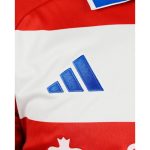 Camiseta de fútbol del Granada CF para la temporada 2026-2027. Primera equipación oficial para adulto en rojo y blanco.